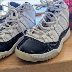 Good used condition patent black and white Jordan 11 dmp